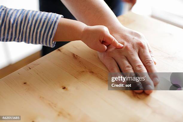 hands of father and baby boy,close up - baby hands pointing stock pictures, royalty-free photos & images