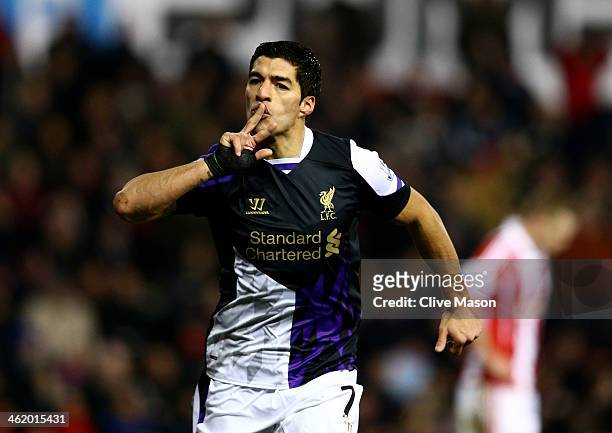 Luis Suarez of Liverpool celebrates as he scorea their second goal during the Barclays Premier League match between Stoke City and Liverpool at...