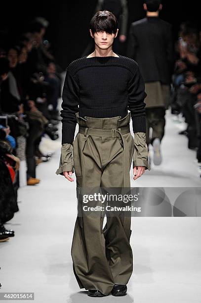 Model walks the runway at the Juun.J Autumn Winter 2015 fashion show during Paris Menswear Fashion Week on January 23, 2015 in Paris, France.