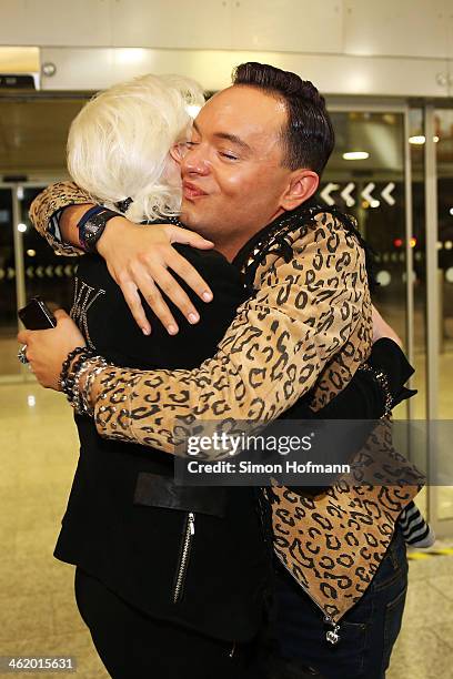 Model Melanie Mueller and fashion designer Julian F. M. Stoeckel hug eachother before the flight to Australia as participants in the 2014 RTL-TV-Show...