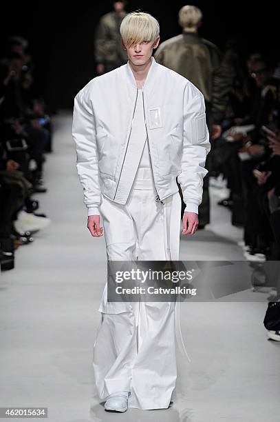 Model walks the runway at the Juun.J Autumn Winter 2015 fashion show during Paris Menswear Fashion Week on January 23, 2015 in Paris, France.