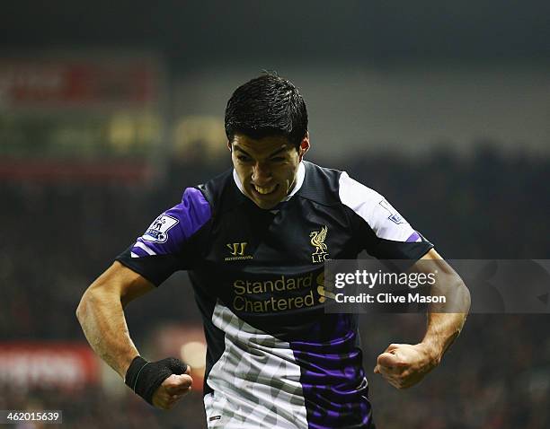 Luis Suarez of Liverpool celebrates as he scores their second goal during the Barclays Premier League match between Stoke City and Liverpool at...