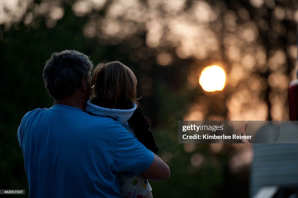 Grandfather and Grandaughter Looking at Sunset