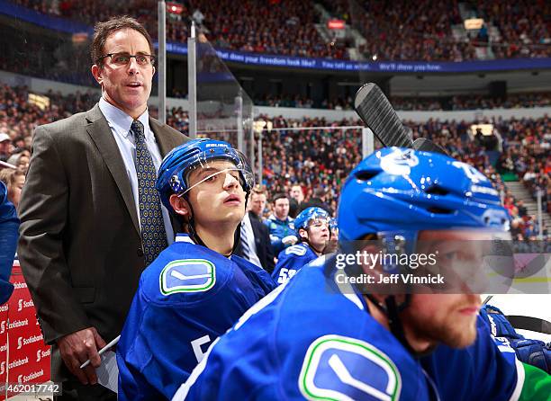 Assistant coach Doug Lidster of the Vancouver Canucks looks on from the bench during their NHL game against the Florida Panthers at Rogers Arena...