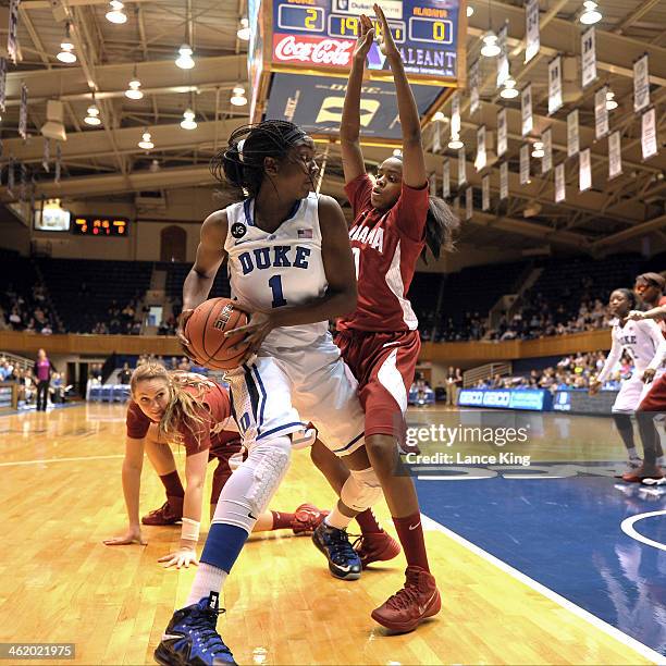 Elizabeth Williams of the Duke Blue Devils looks to pass against Daisha Simmons of the Alabama Crimson Tide at Cameron Indoor Stadium on November 17,...