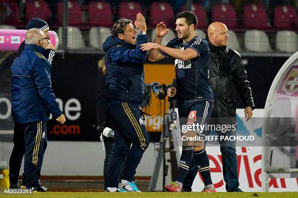 Marseille's French forward Andre-Pierre Gignac celebrates after scoring a goal during the French L1 football match between Evian Thonon Gaillard FC...