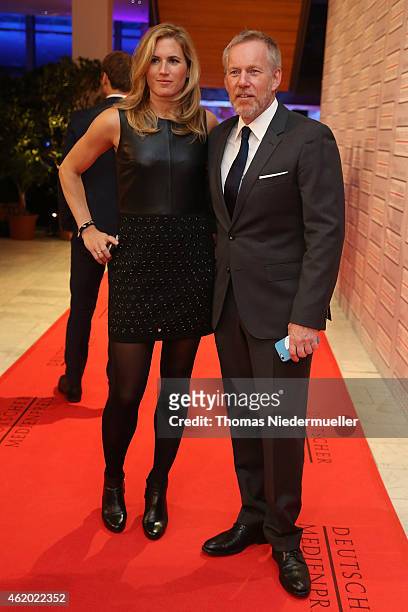 Johannes B. Kerner and his wife Britta Becker arrive the red carpet during the German Media Award 2014 on January 23, 2015 in Baden-Baden, Germany.