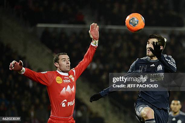 Evian's French goalkeeper Bertrand Laquait vies with Marseille's French forward Andre-Pierre Gignac during the French L1 football match Evian Thonon...