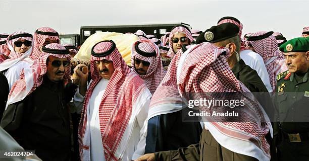 Saudi new King Salman bin Abdul Aziz is seen as mourners and family members burying the body of the late Saudi King, Abdullah bin Abdulaziz al-Saud,...