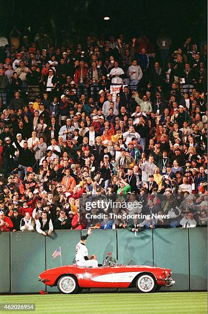 Cal Ripken of the Baltimore Orioles acknowledges the crowd against the Boston Red Sox at Oriole Park at Camden Yards on October 6, 2001 in Baltimore,...