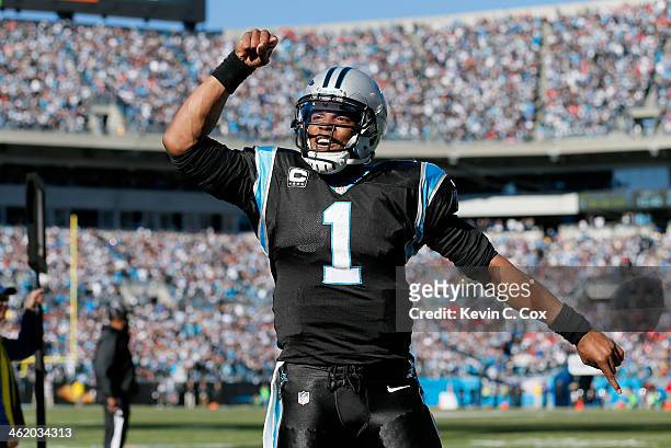 Cam Newton of the Carolina Panthers celebrates after a touchdown pass to Steve Smith in the second quarter against the San Francisco 49ers during the...