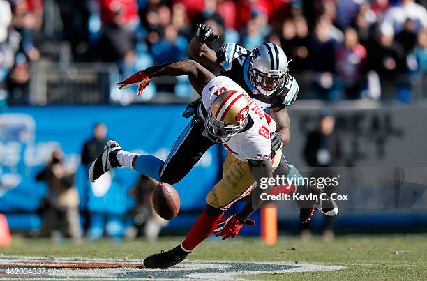 Anquan Boldin of the San Francisco 49ers tries to make a catch against Quintin Mikell of the Carolina Panthers in the second quarter during the NFC...