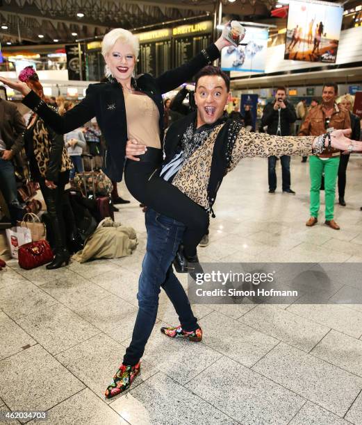 Model Melanie Mueller poses with fashion designer Julian F. M. Stoeckel before the flight to Australia as a participant in the 2014 RTL-TV-Show...