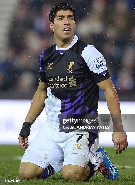 Liverpool's Uruguayan forward Luis Suárez reacts during an English Premier League football match between Stoke City and Liverpool at The Britannia...