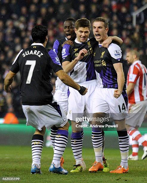 Steven Gerrard of Liverpool celebrates after scoring from the penalty during the Barclays Premier Leauge match between Stoke City and Liverpool at...