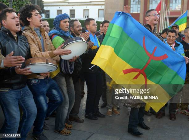 Members from the Moroccan Amazigh Berber community sing and wave the Amazigh flag as they celebrate on the eve of the 2964th Amazigh new year near...