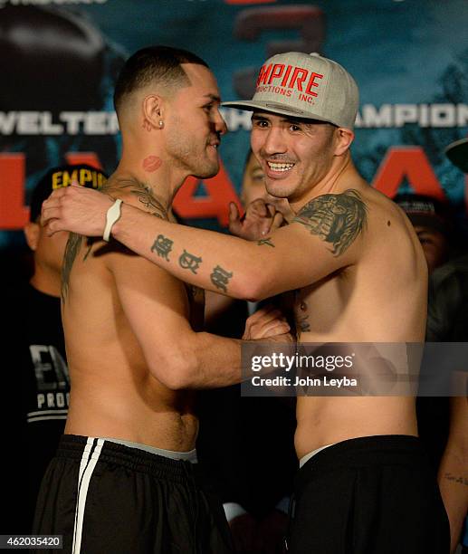 Mike Alvarado and Brandon Rios hug after their weigh in January 23, 2015 at the Tailgate Roadhouse for the upcoming WBO International Welterweight...