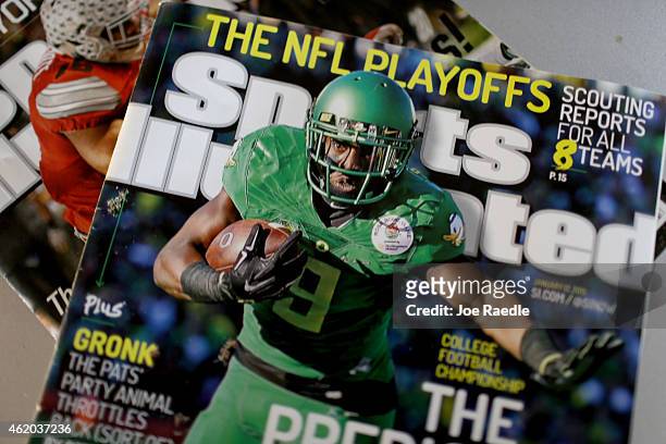 In this photo illustration, Sports Illustrated magazines are seen on January 23, 2015 in Miami, Florida. Time Inc. The parent company of the magazine...