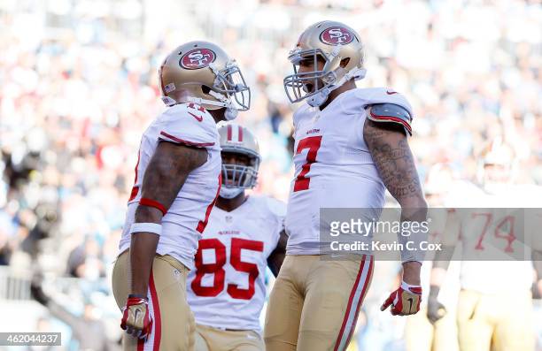 Colin Kaepernick of the San Francisco 49ers celebrates with Quinton Patton after a touchdown in the third quarter against the Carolina Panthers...