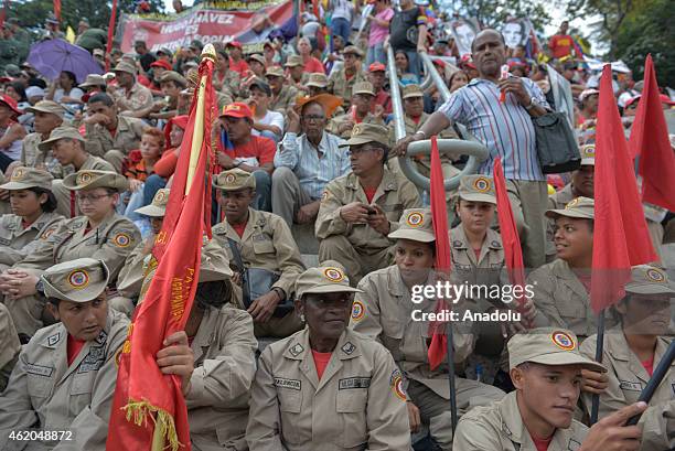 Members of Venezuela's militia listen as Venezuelan President Nicolas Maduro gives a speech during the "March of the Undefeated" commemorating the...