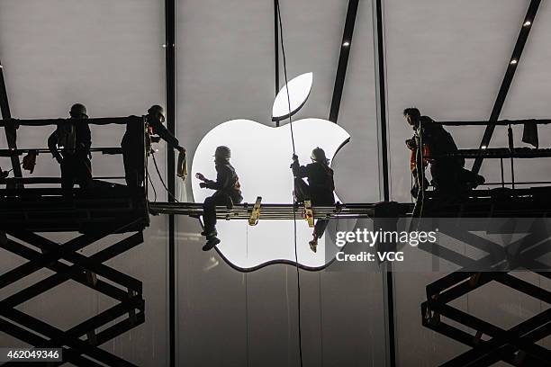 Workers prepare outside the largest Apple Store in Asia for its opening on January 23, 2015 in Hangzhou, Zhejiang province of China. The Apple Store...