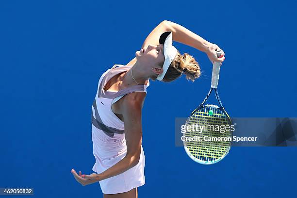 Kaylah McPhee of Australia serves in her match against Shilin Xu of China during the Australian Open 2015 Junior Championships at Melbourne Park on...