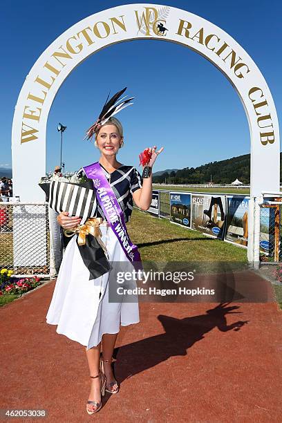 Fahion in the Field Supreme Winner Julie Barbour of Hamilton poses with the keys to her new Volkswagon during Wellington Cup Day at Trentham...