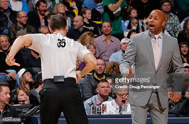 Head coach Brian Shaw of the Denver Nuggets protests a call by referee Kane Fitzgerald as they face the Boston Celtics at Pepsi Center on January 23,...