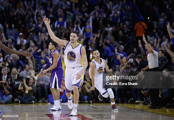 Klay Thompson of the Golden State Warriors reacts after he made a three-point basket in the third quarter of their game against the Sacramento Kings...