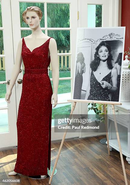 An on-set still and a dress worn by actress Pamela Sue Martin photographed on the set of "Dynasty" Reunion on "Home & Family" at Universal Studios...