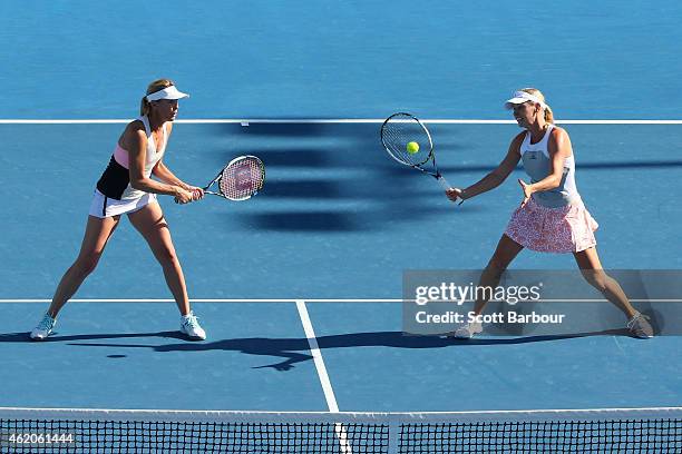 Nina Bratchikova of Russia and Barbara Schett of Austria in action in their second round doubles match against Mary Joe Fernandez of the United...