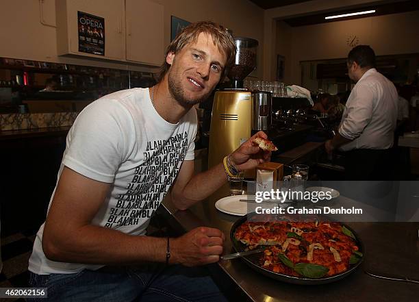 Andreas Seppi of Italy smiles as he visits Italian cafe Pellegrini's during the 2015 Australian Open at Melbourne Park on January 24, 2015 in...