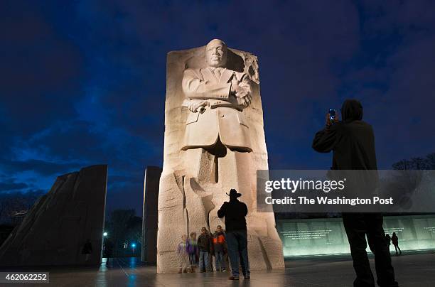 Tourists visit the Martin Luther King Monument the eve of the Federally-recognized holiday and day of service in Washington, DC on January 18, 2015....