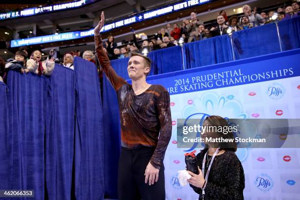 Jeremy Abbott, with his coach Yuka Sato, celebrates in the kiss and cry after skating in the free skate during the Prudential U.S. Figure Skating...