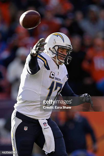 Philip Rivers of the San Diego Chargers throws a pass against the Denver Broncos during the AFC Divisional Playoff Game at Sports Authority Field at...