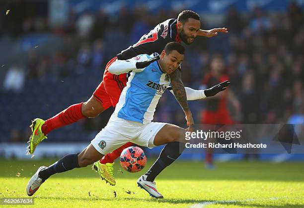 Kyle Bartley of Swansea City tangles with Joshua King of Blackburn Rovers during the FA Cup Fourth Round match between Blackburn Rovers and Swansea...