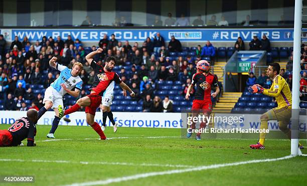 Chris Taylor of Blackburn Rovers scores their first and equalising goal past goalkeeper Lukasz Fabianski of Swansea City during the FA Cup Fourth...