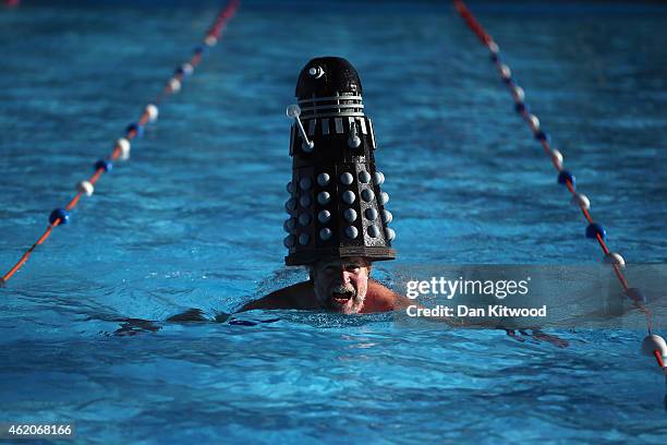 Competitor with a Dalek on his head takes part in the annual UK Cold Water Swimming Championships at Tooting Bec Lido on January 24, 2015 in London,...