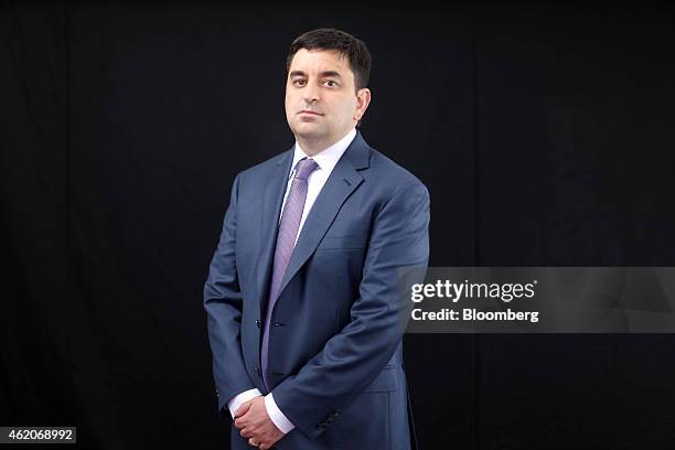 Gregory "Greg" Jensen, co-chief executive officer of Bridgewater Associates, poses for a photograph following a Bloomberg Television interview on day...