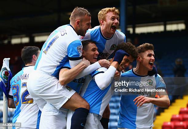 Rudy Gestede of Blackburn Rovers celebrates with team mates as he scores their second goal during the FA Cup Fourth Round match between Blackburn...