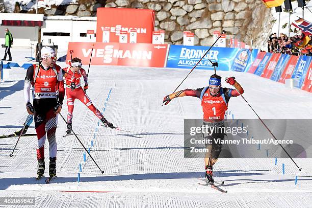 Simon Schempp of Germany takes 1st place, Simon Eder of Austria takes 2nd place during the IBU Biathlon World Cup Men's and Women's Pursuit on...