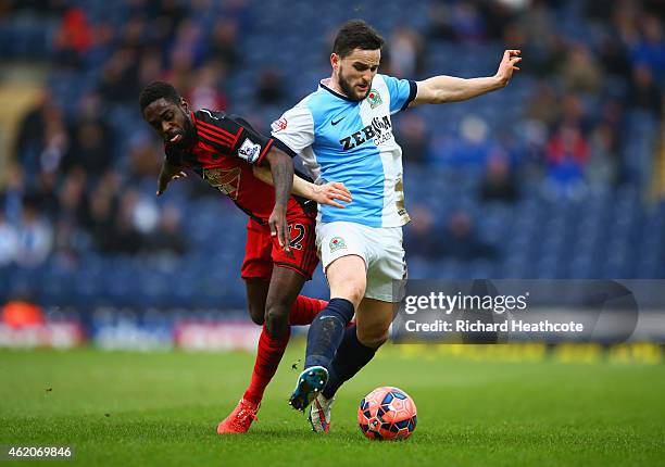 Craig Conway of Blackburn Rovers battles with Nathan Dyer of Swansea City during the FA Cup Fourth Round match between Blackburn Rovers and Swansea...