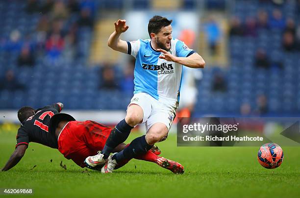 Craig Conway of Blackburn Rovers battles with Nathan Dyer of Swansea City during the FA Cup Fourth Round match between Blackburn Rovers and Swansea...