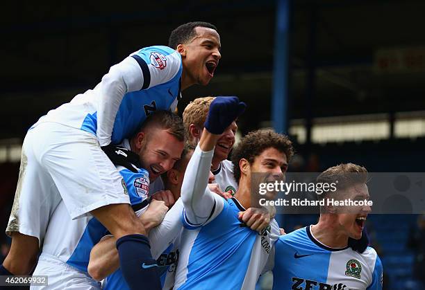 Rudy Gestede of Blackburn Rovers celebrates with team mates as he scores their second goal during the FA Cup Fourth Round match between Blackburn...