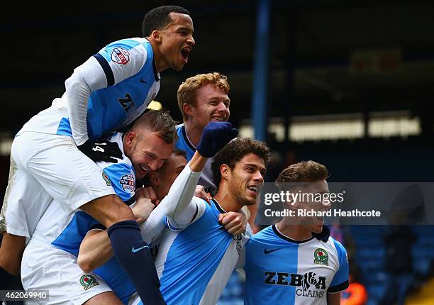 Rudy Gestede of Blackburn Rovers celebrates with team mates as he scores their second goal during the FA Cup Fourth Round match between Blackburn...