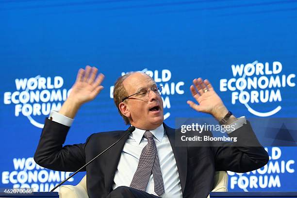 Laurence "Larry" Fink, chief executive of BlackRock Inc., gestures as he speaks during a session on the final day of the World Economic Forum in...