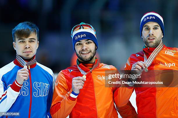 Sjinkie Knegt of the Netherlands, #61 Semion Elistratov of Russia and Daan Breeuwsma of the Netherlands pose after the Mens 1500m final during day 2...