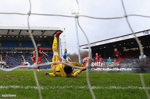 Lukasz Fabianski of Swansea City fails to stop Craig Conway of Blackburn Rovers from scoring their third goal during the FA Cup Fourth Round match...
