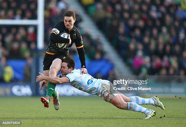 George North of Northampton Saints is tackled by Henry Chavancy of Racing Metro 92 during the European Rugby Champions Cup match between Northampton...