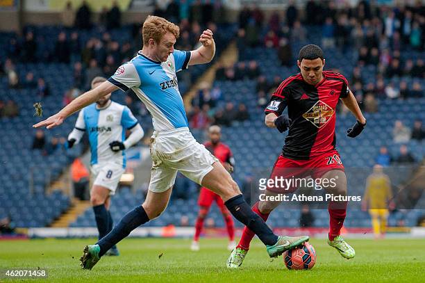 Chris Taylor of Blackburn Rovers takes the ball from underneath Jefferson Montero of Swansea City during the FA Cup Fourth Round match between...